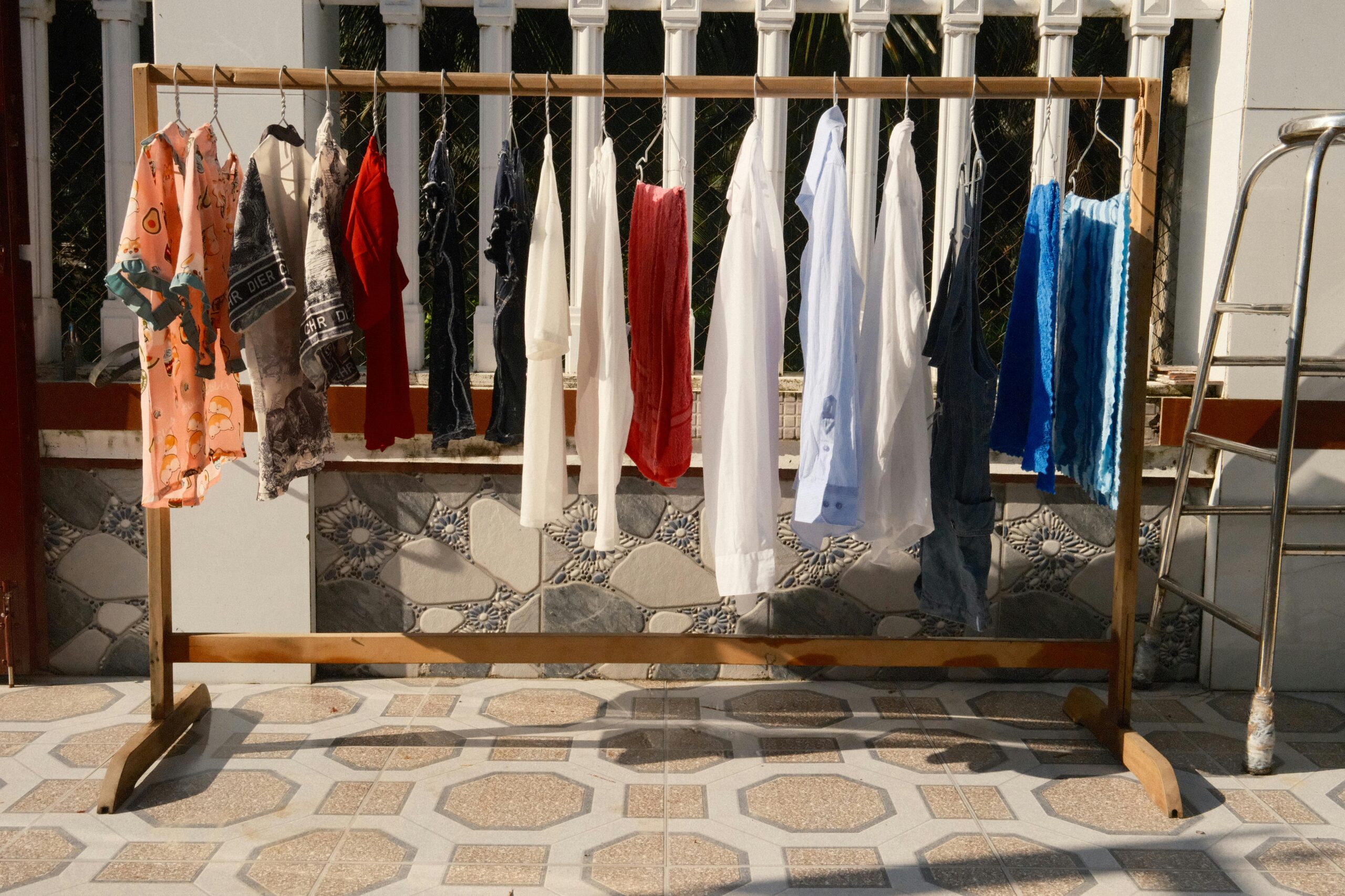 Services A variety of colorful clothes hanging to dry in the sunlight of Bến Tre, Vietnam.